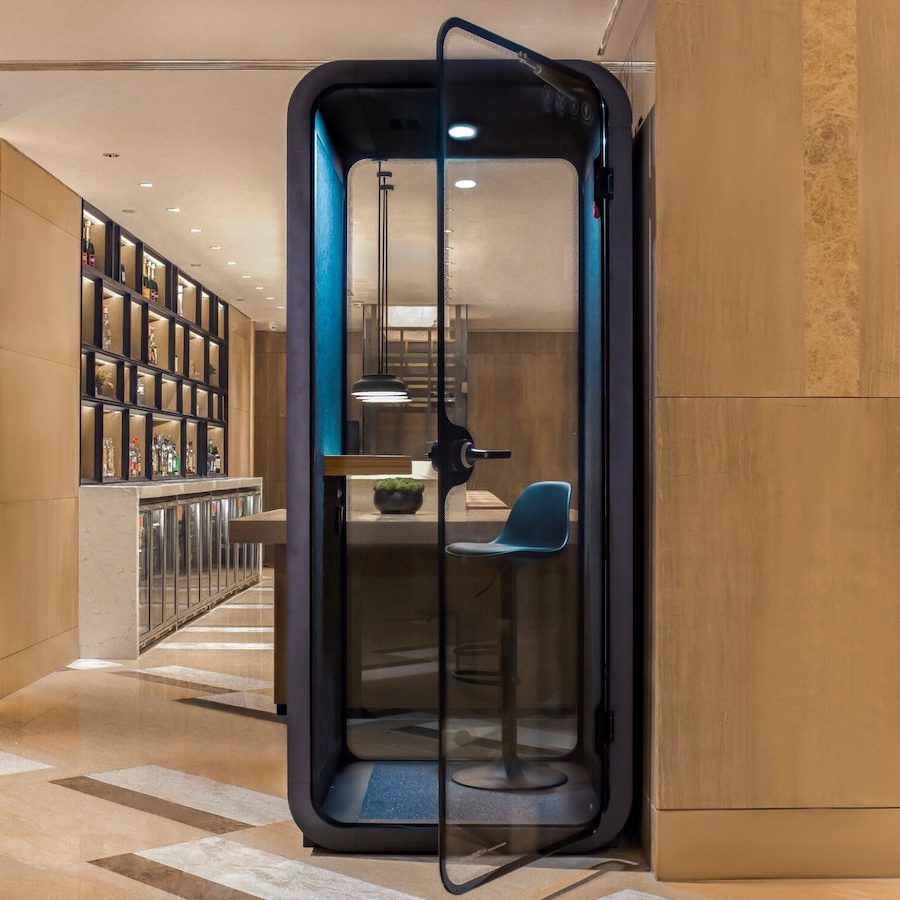 a glass door with a chair inside