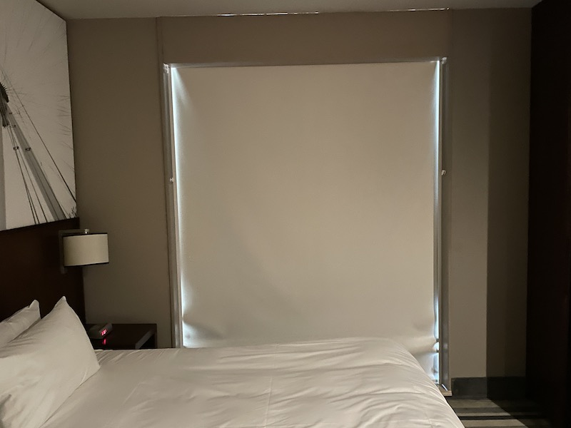 a bed with a white curtain