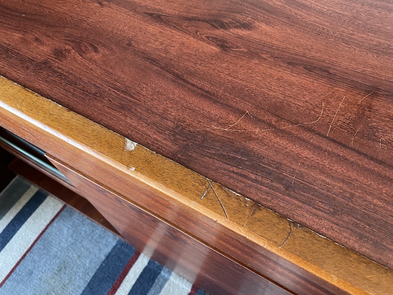 a wood surface with scratches on it