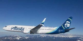 a plane flying over mountains
