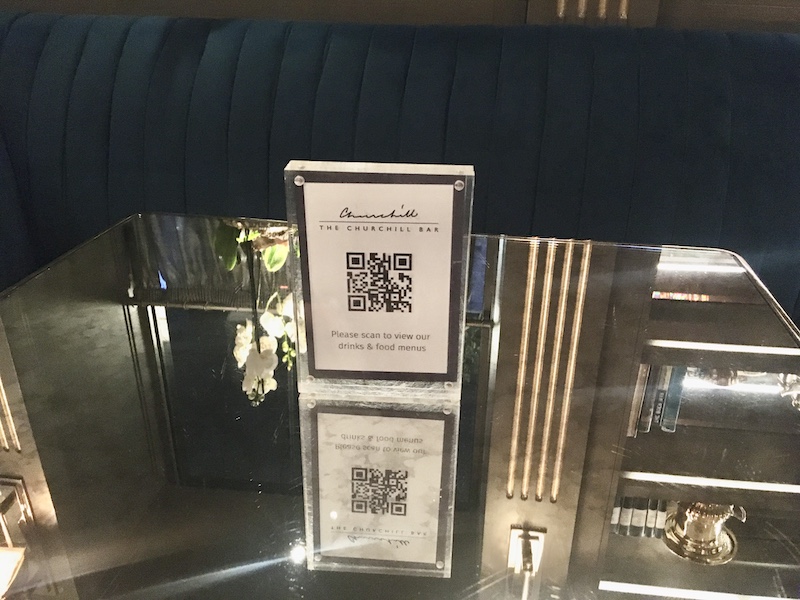 a bar with qr code on a glass table