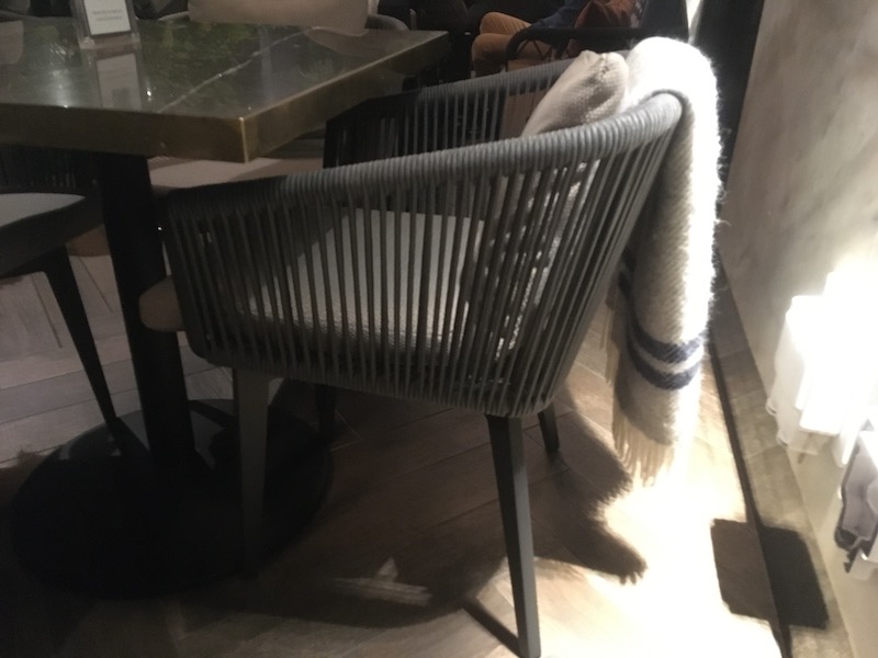 a chair with a blanket on the back