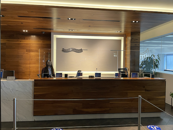 a reception desk with a person standing behind it