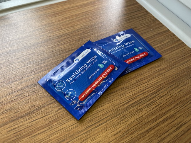 two packages of sanitizing wipes on a table