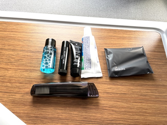a group of toiletries and a bag of toiletries on a table