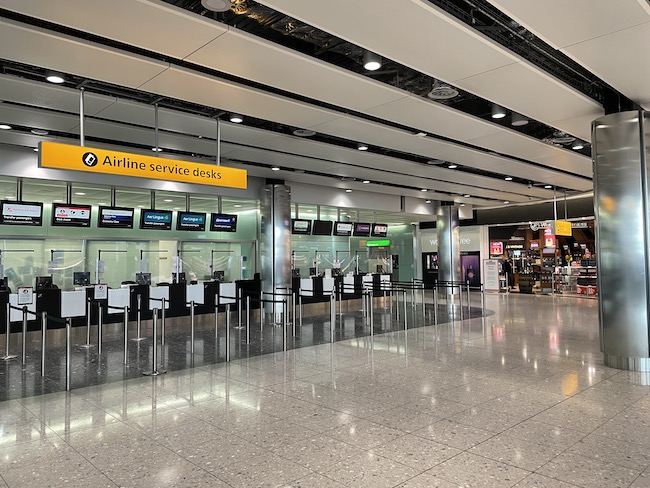 a large airport terminal with check in counters