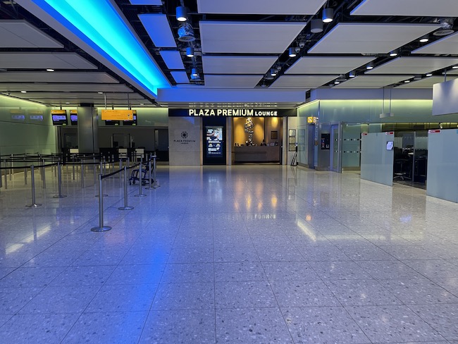 an empty airport terminal with a blue light