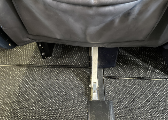 a metal arm rest on a chair