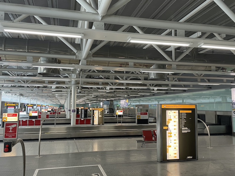 an airport terminal with luggage conveyor belts