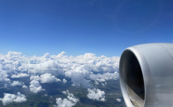 an airplane wing and clouds