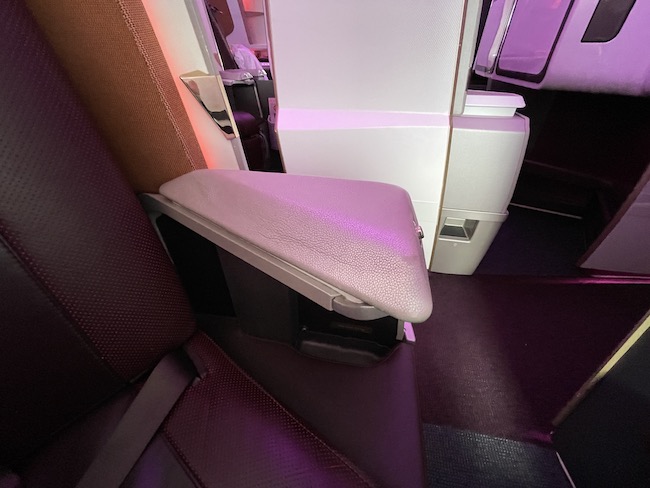 a seat arm rest in a plane