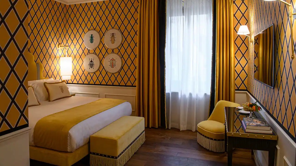 a room with yellow curtains and a bed