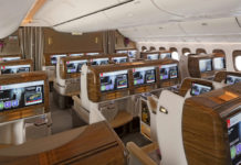 a plane with many seats and monitors