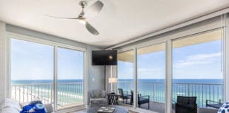 a living room with a view of the ocean