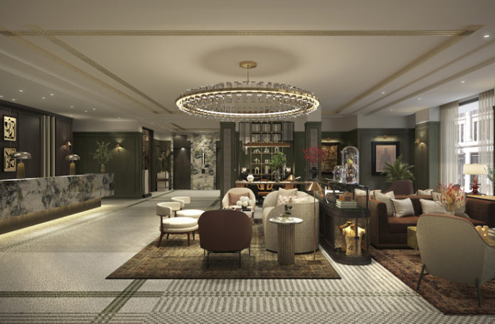 a lobby with a chandelier and chairs