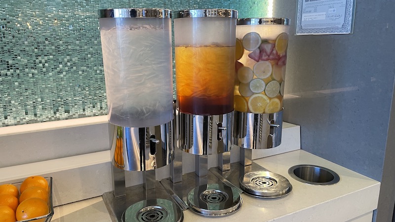 a group of dispensers with different colored liquid