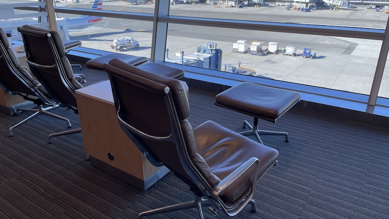 a chair and a table in an airport
