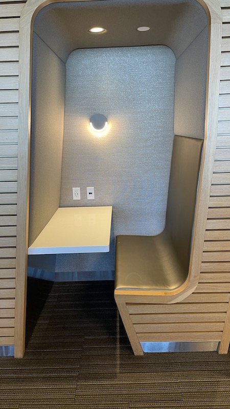 a booth with a table and a light