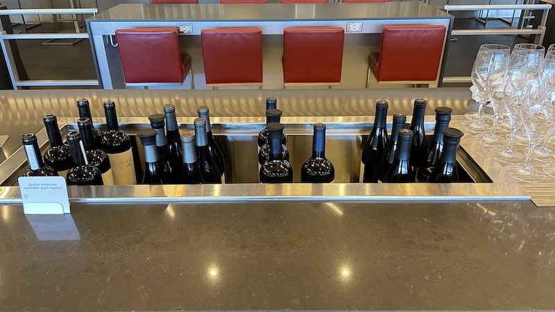 a group of bottles of wine in a metal container