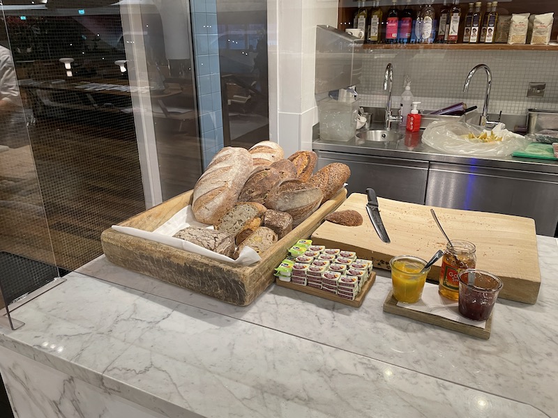 a tray of bread and jams on a counter