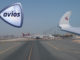 a group of airplanes on a runway