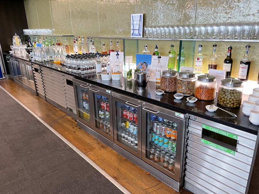 a bar with bottles and drinks