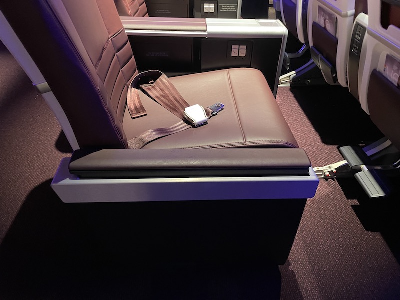 seat in an airplane with a seat belt