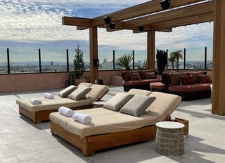 a group of lounge chairs on a patio