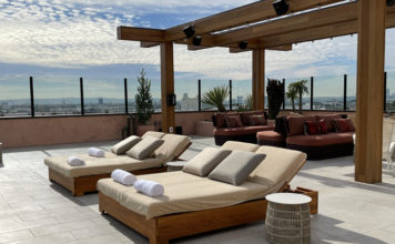 a group of lounge chairs on a patio