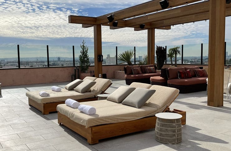 a group of lounge chairs on a patio