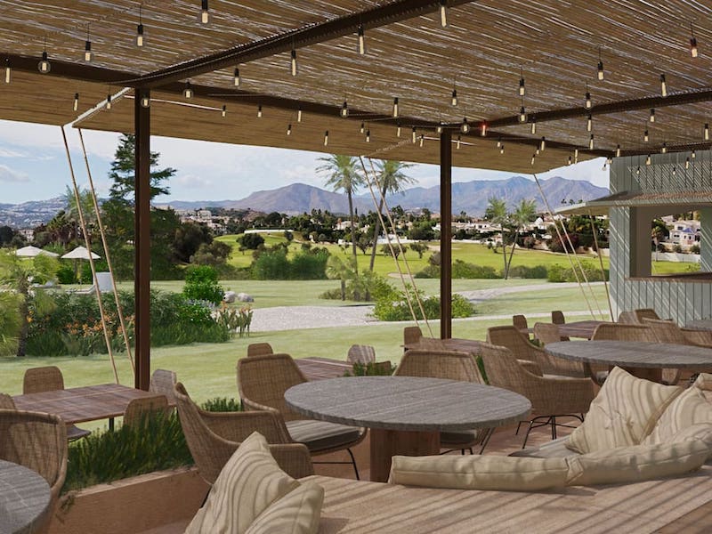 a patio with a golf course view