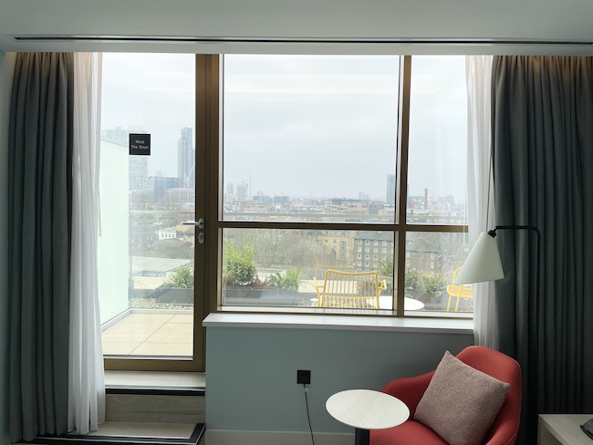 a room with a red chair and a table