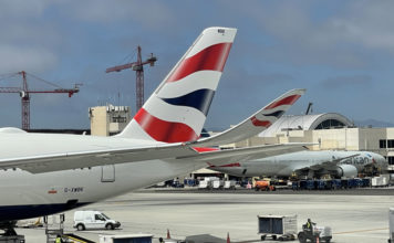 a group of airplanes at an airport