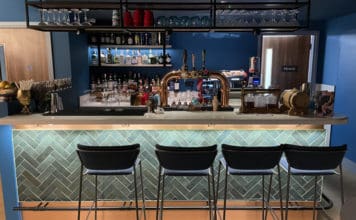 11 reasons to love the Chase Sapphire Preferred® Card (most are reasons why I hold it right now) a bar with a row of chairs and a beer tap