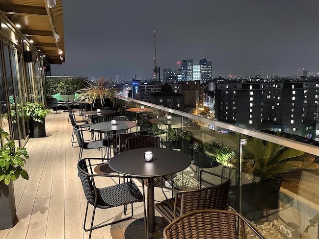 a table and chairs on a rooftop