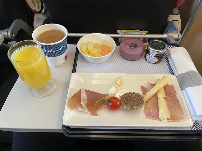 a tray of food and drinks on a plane