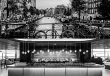 a bar with a bar and a river in the background
