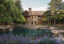 a house with a pool and trees