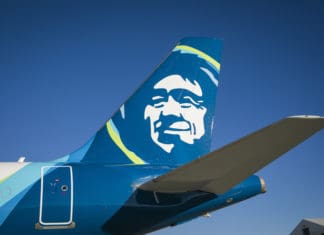 the tail of a plane with a face on it