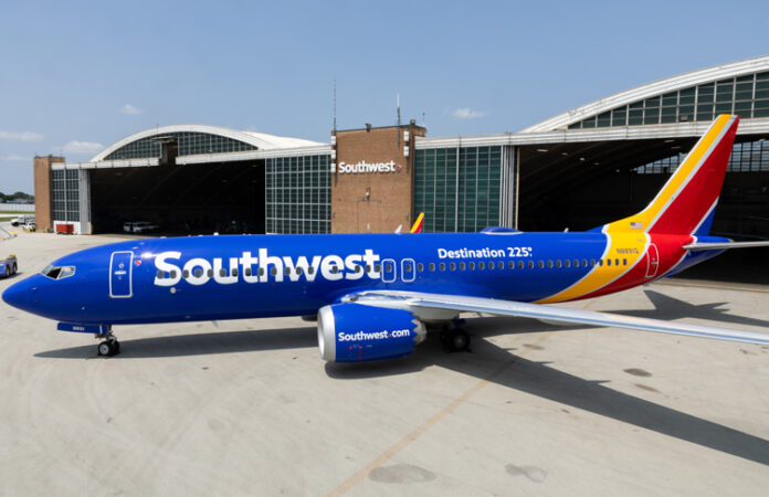 a southwest airlines airplane parked in a hangar
