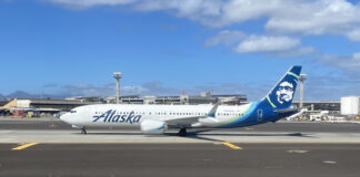 a white airplane on a runway