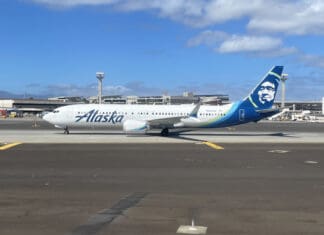 a white airplane on a runway