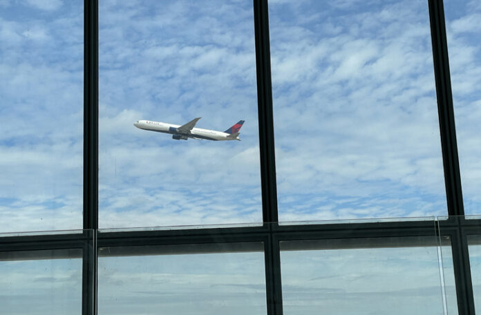 a plane flying through a window