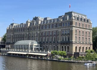 a building with a river in the background