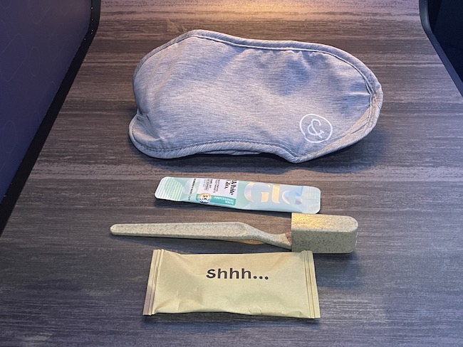 a sleeping mask and a bag with a sledgehammer