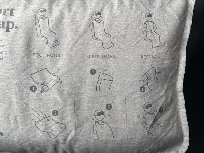 a grey pillow with instructions