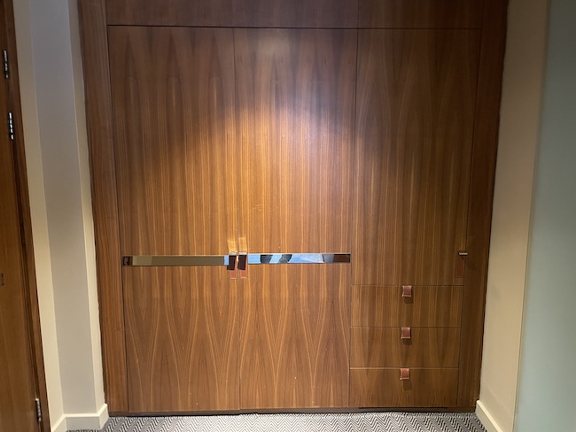 a wooden door with a silver handle