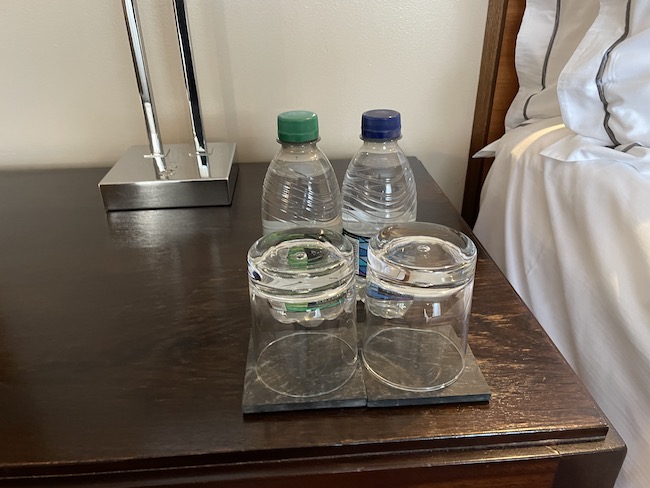 a group of clear water bottles on a table