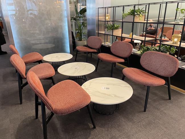 a group of chairs and tables in a room