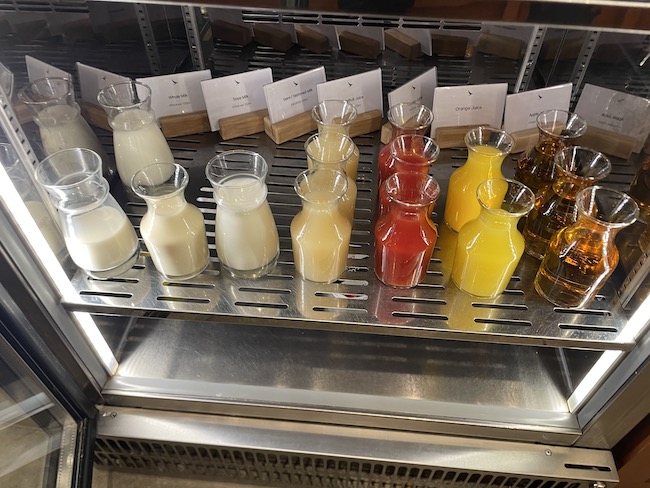 a shelf with different drinks on it
